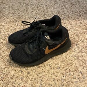 Black and Gold Nike Sneakers